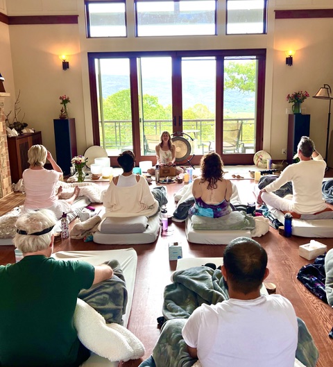 Lisa leading a sound bath ceremony inside a sacred dome
